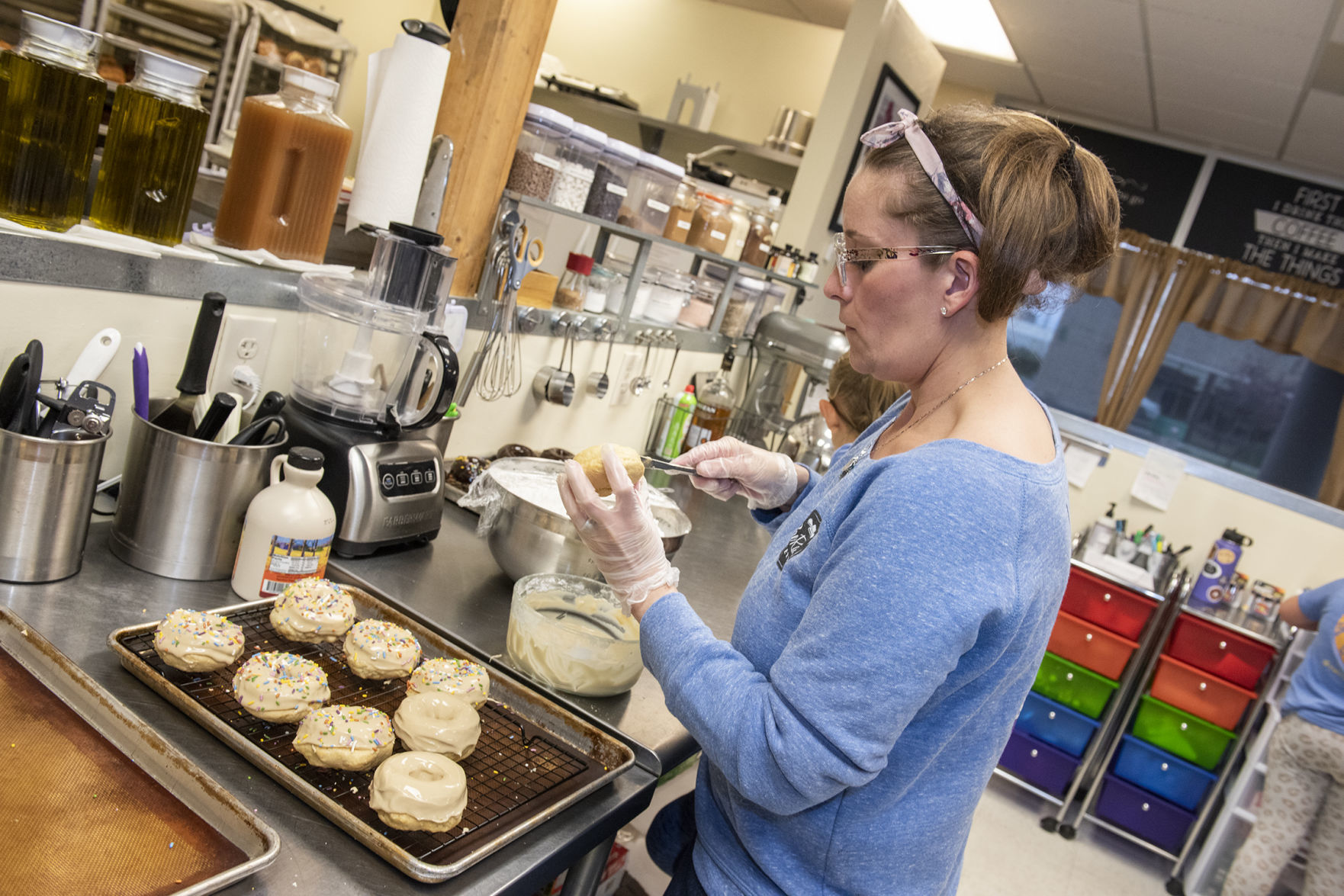 Heather Bahm frosts doughnuts